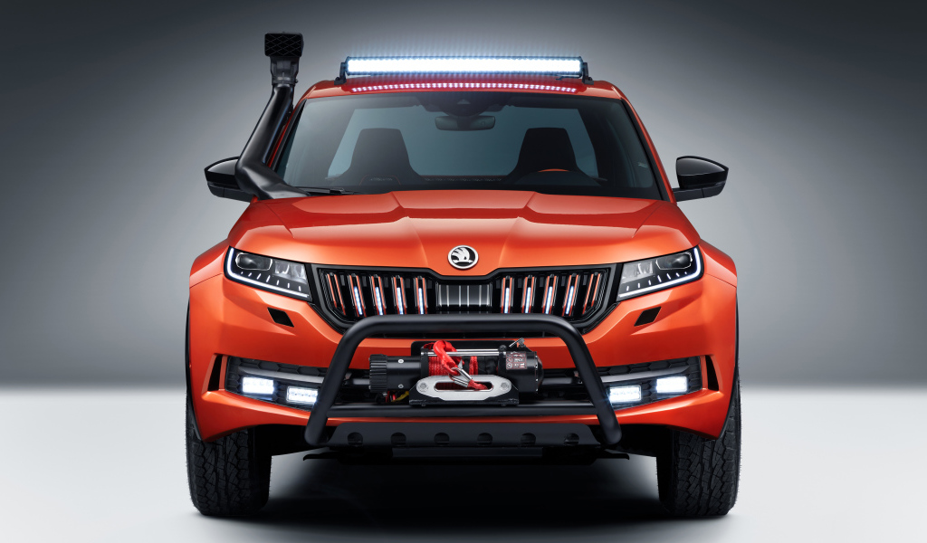 Красный внедорожник Skoda Mountiaq Concept 2019 года на сером фоне