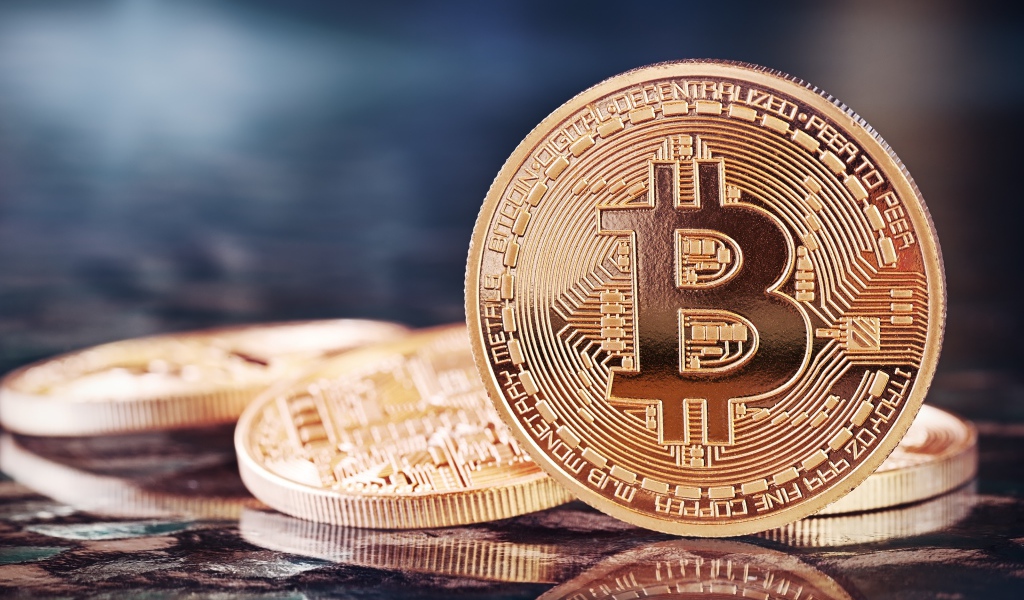 Big golden bitcoin coin close up