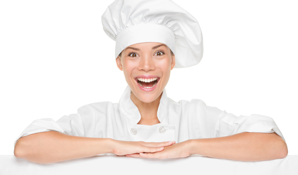 Улыбающаяся девушка повар на белом фоне