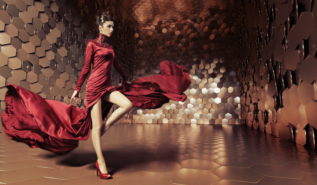 Яркая девушка в красивом красном платье в комнате 