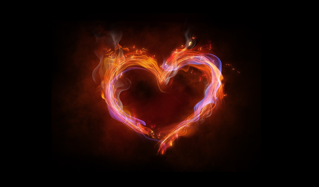 Огненное неоновое сердце на черном фоне