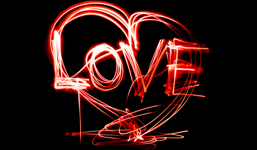 Красная неоновая надпись Love  на черном фоне