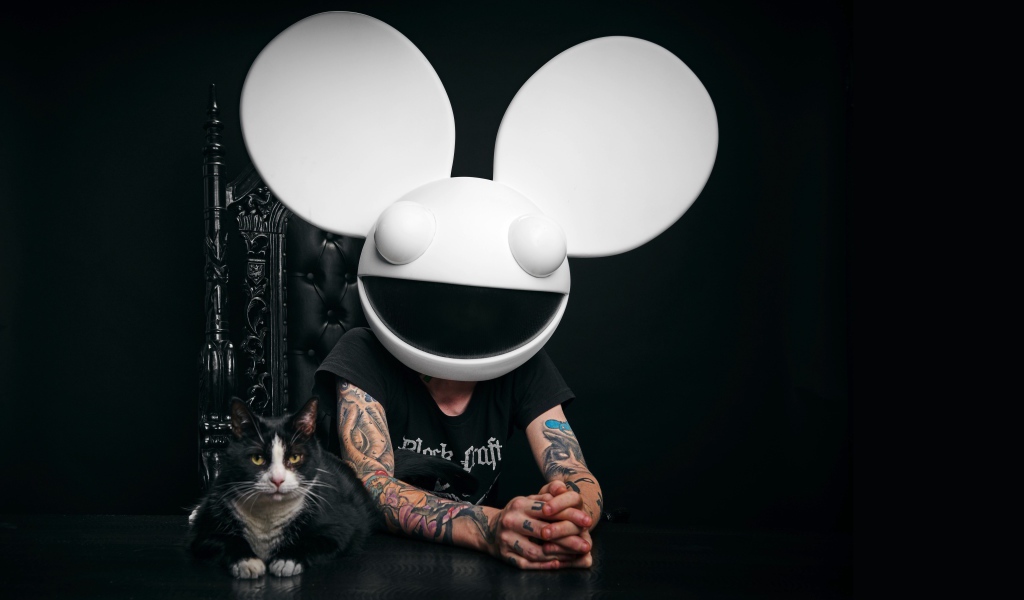 DJ Dedmaus with a cat on a black background