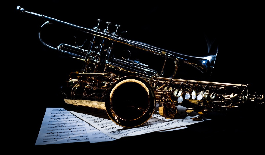 Saxophones on notes on a black background