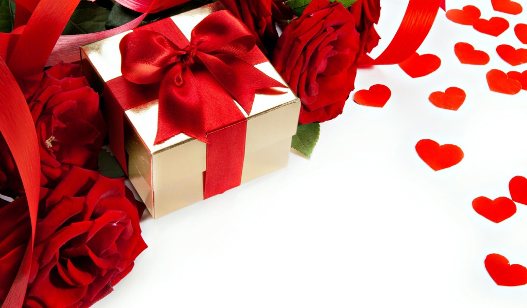 Подарок с красным бантом на белом фоне с красными розами и сердечками