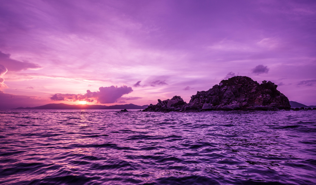 Water in the sea on a background of purple sunset