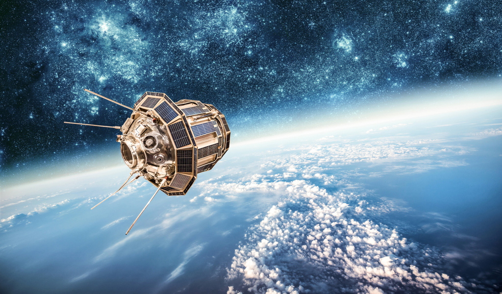 Спутник бороздит просторы бескрайнего космоса 