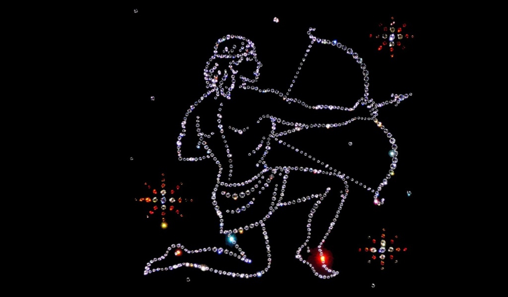 Блестящий знак зодиака стрелец на черном фоне