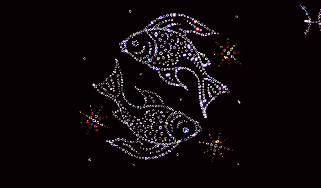 Блестящий знак зодиака рыбы на черном фоне