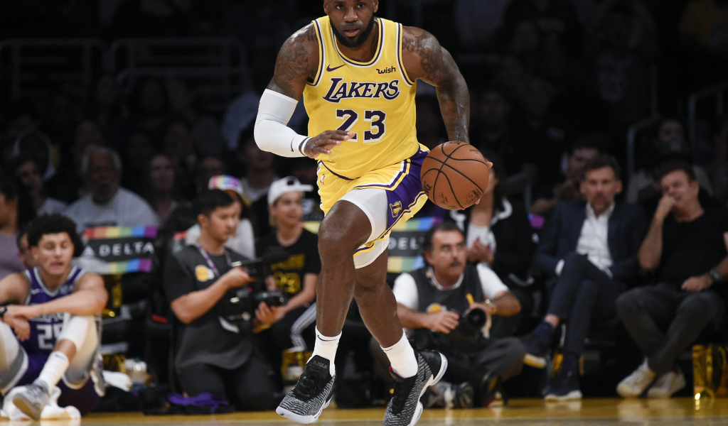 Basketball player LeBron James on the field with the ball