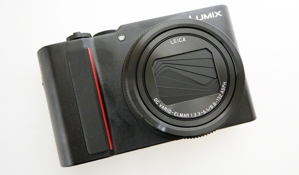 Black camera Panasonic Lumix ZS200 TZ200 on a white background