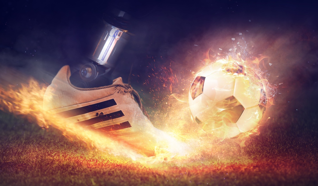 Foot beats off a fiery soccer ball