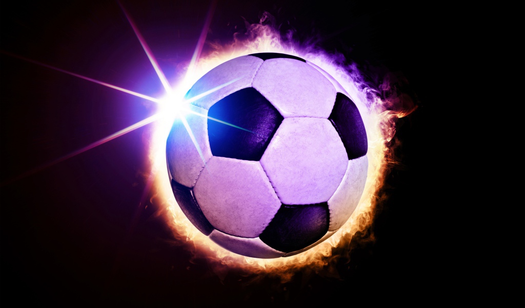 Футбольный мяч в огненном кольце на черном фоне