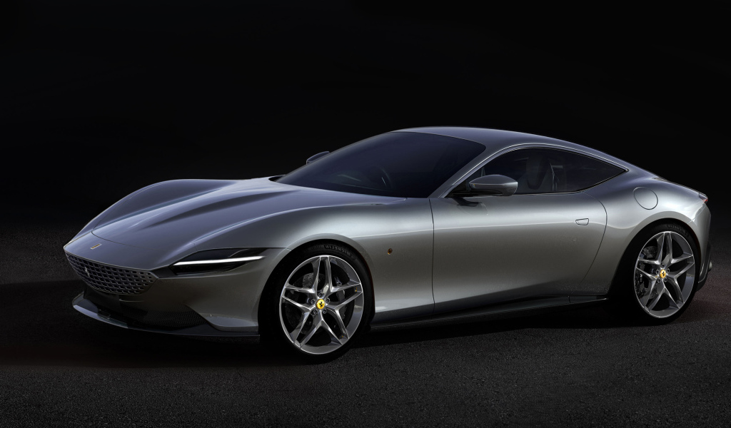 Серый автомобиль Aston Martin DBS Superleggera 2019 года на черном фоне