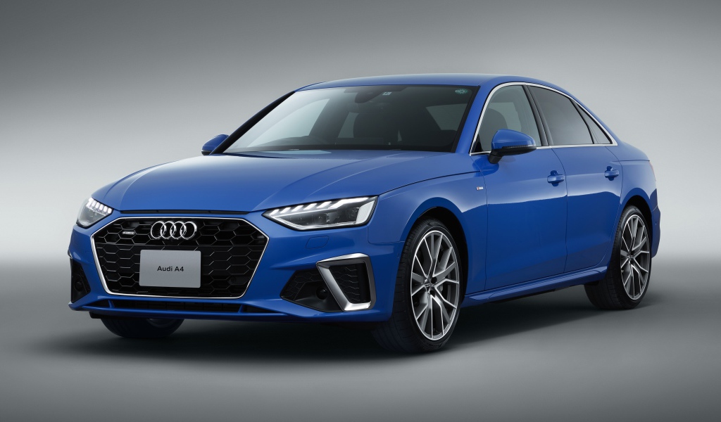 Синий автомобиль Audi A4 45 TFSI Quattro S Line 2020 года на сером фоне 