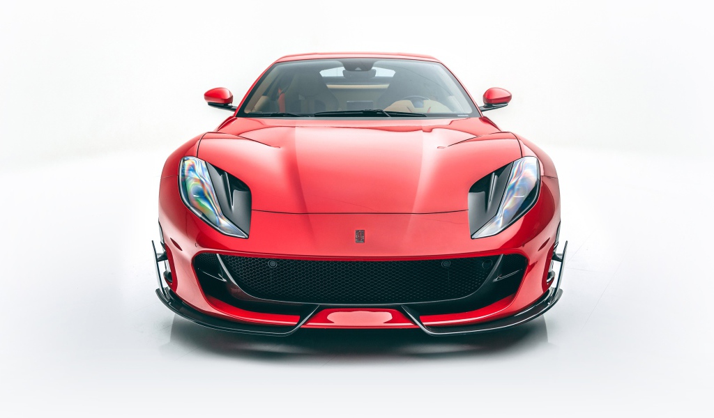 Красный автомобиль Mansory Ferrari 812,  2020 года на белом фоне