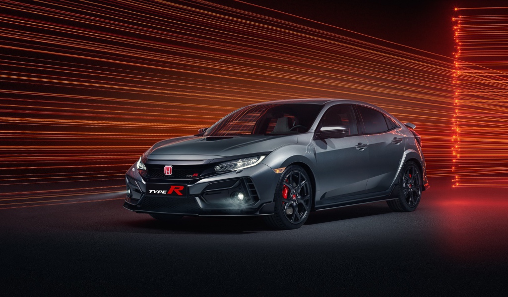 Серебристый автомобиль Honda Civic Type R Sport Line 2020 года на фоне лучей 