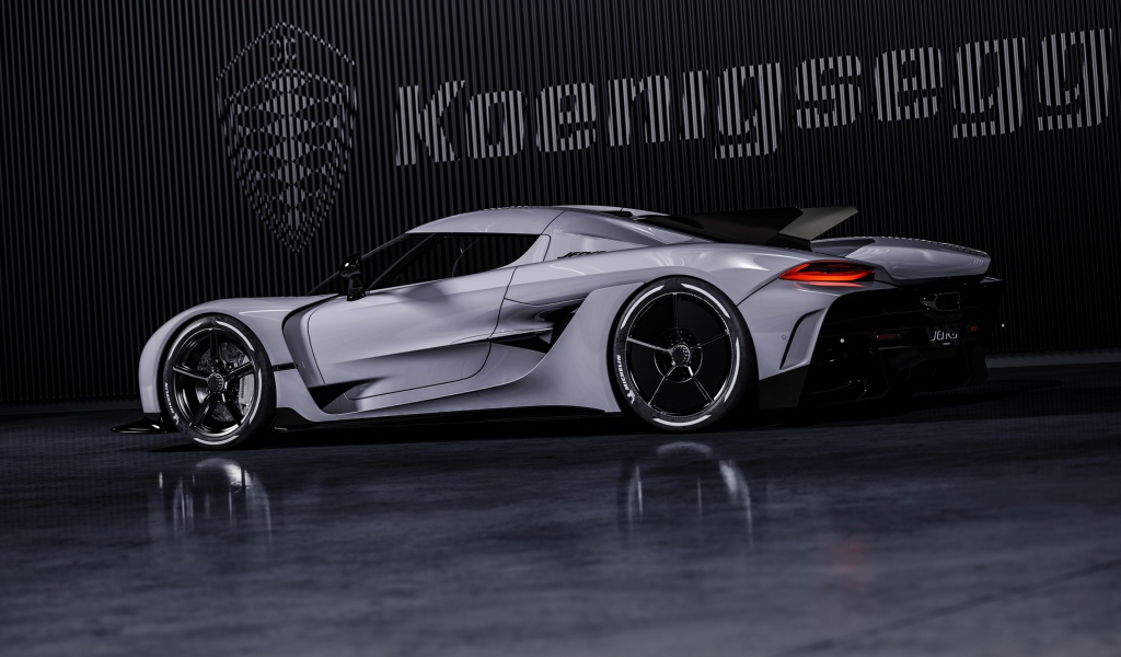 Автомобиль Koenigsegg Jesko Absolut 2020 года на фоне логотипа