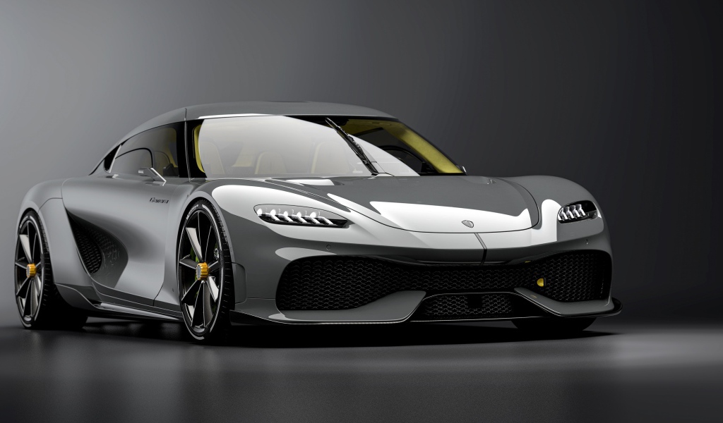 Быстрый автомобиль Koenigsegg Gemera 2020 года на сером фоне