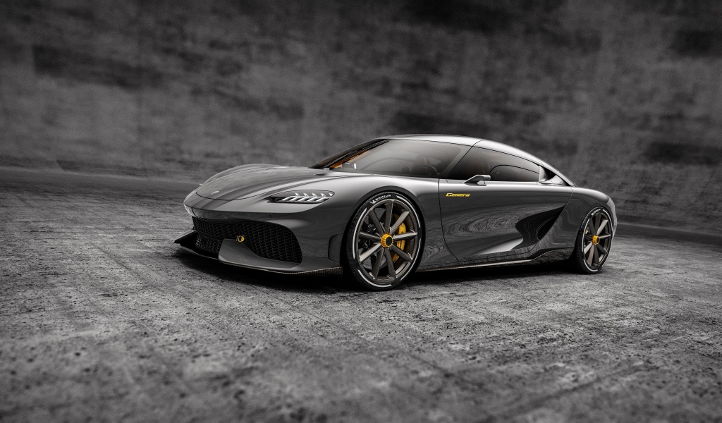 Серебристый автомобиль Koenigsegg Gemera 2020 года на сером фоне