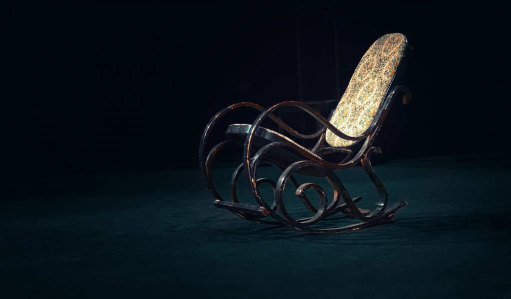 Old rocking chair in a dark room