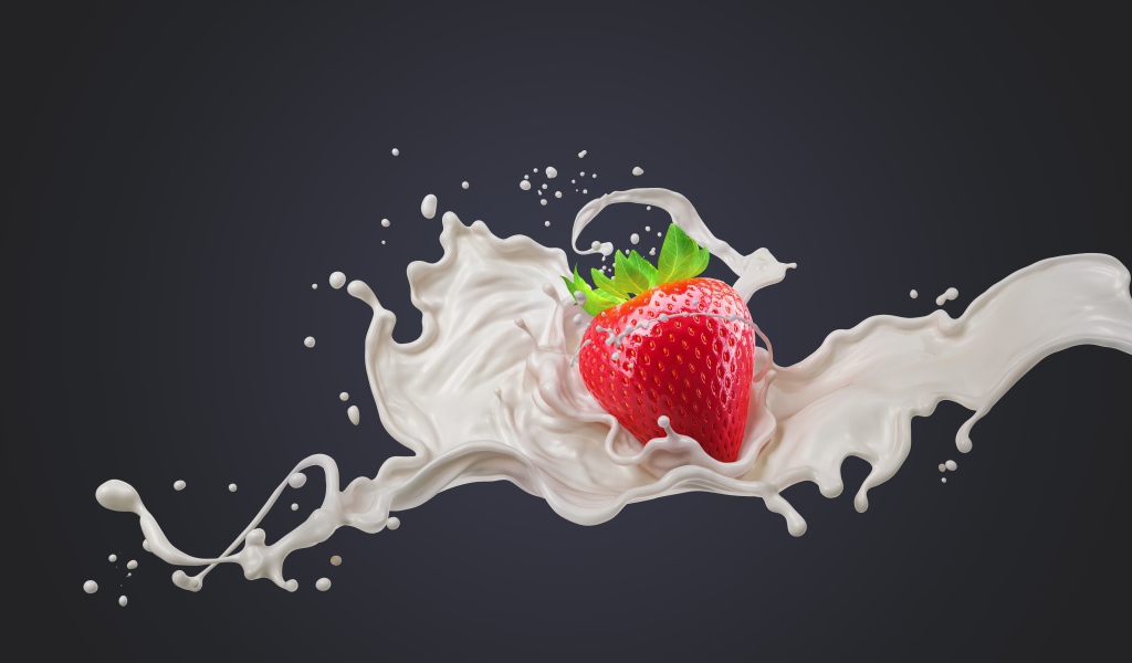 Красная клубника в молоке на сером фоне