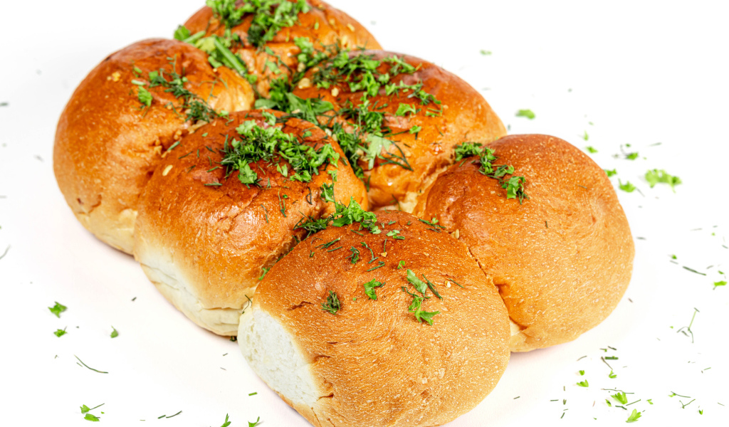 Garlic buns with herbs on a white background