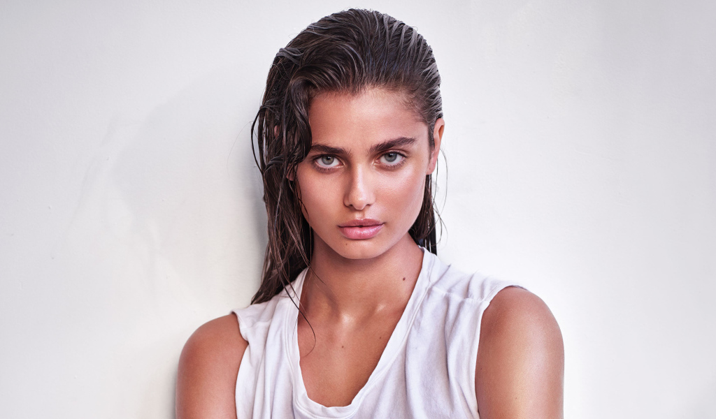 Girl with wet hair, model Taylor Hill on a white background