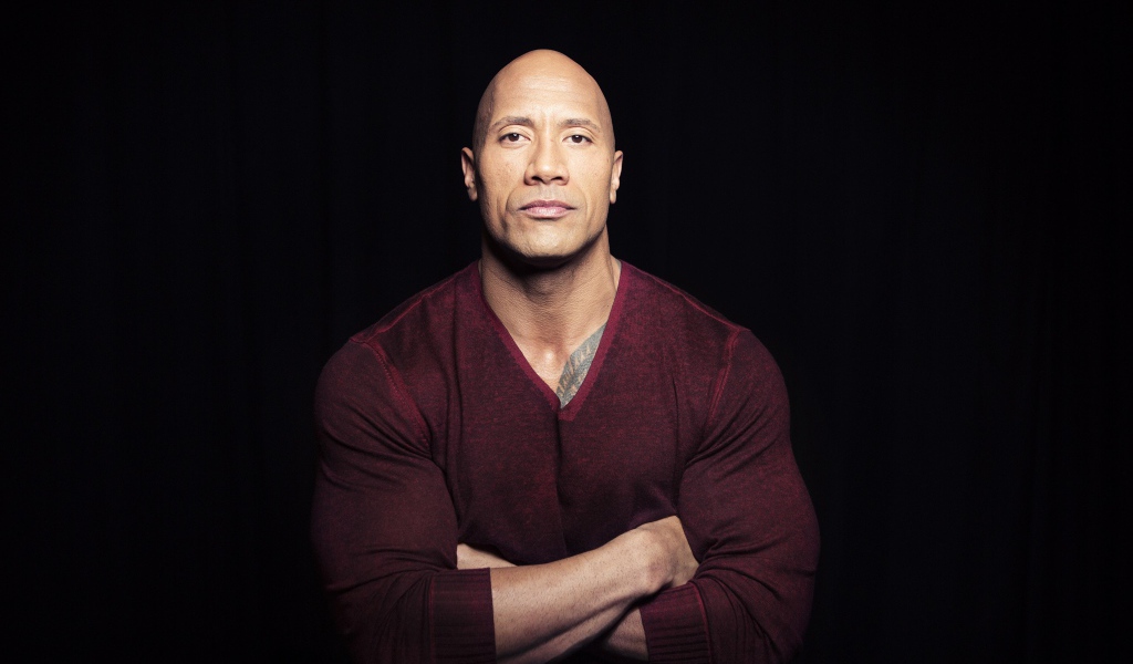 Актер Дуэйн Джонсон на черном фоне