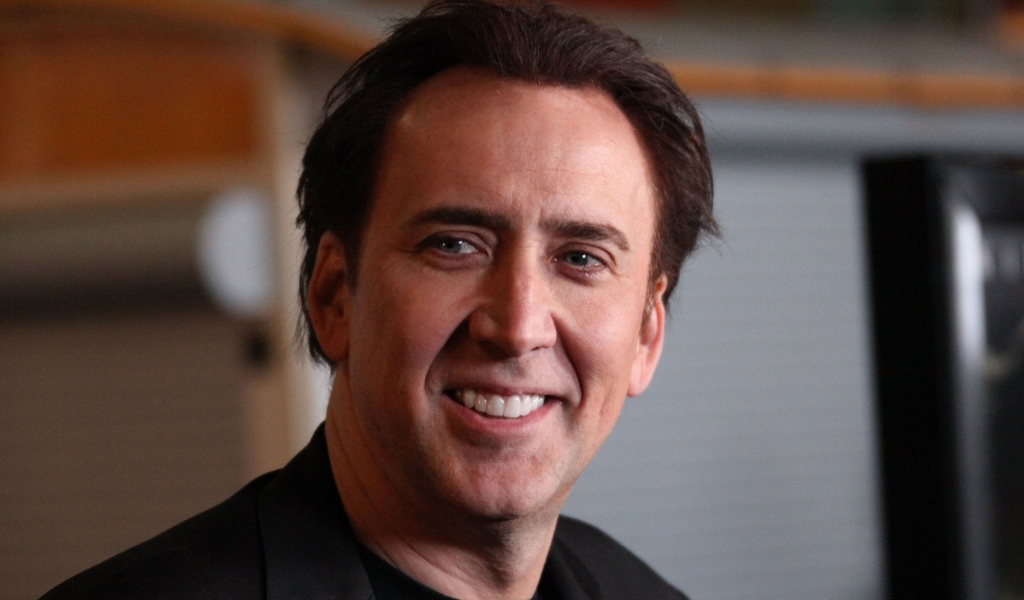 Улыбающийся мужчина,  актер Николас Кейдж