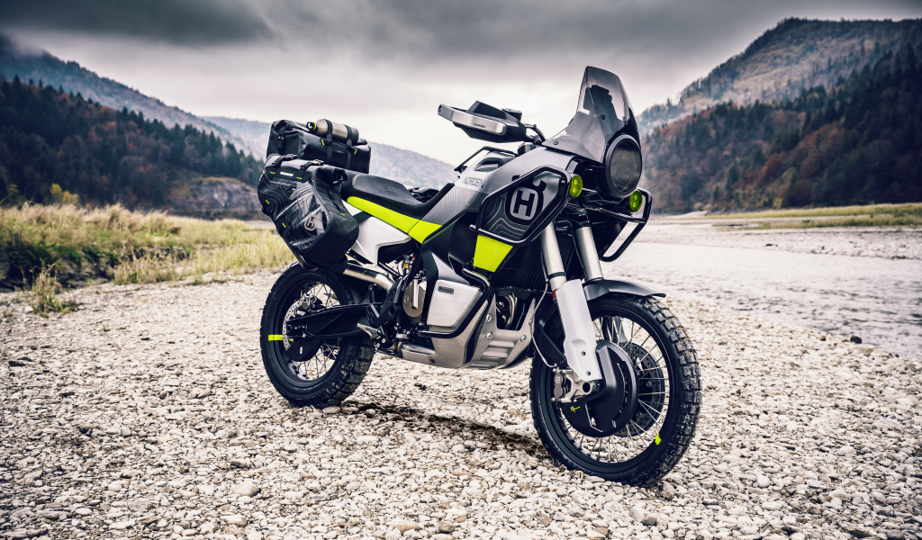 Husqvarna Norden 901 motorcycle on a background of mountains