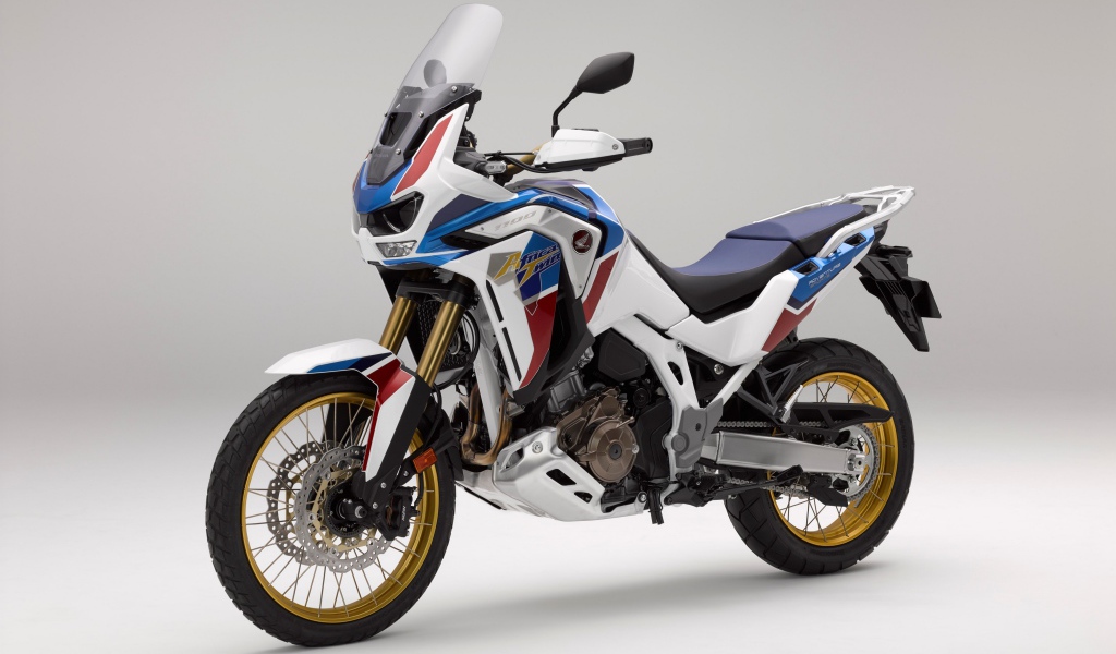 Спортивный мотоцикл Honda  CRF 1000 D, 2020  года на сером фоне