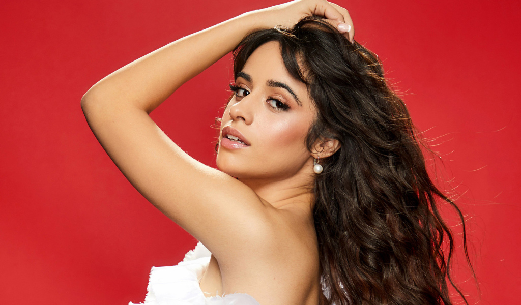 Singer Camila Cabello on a red background