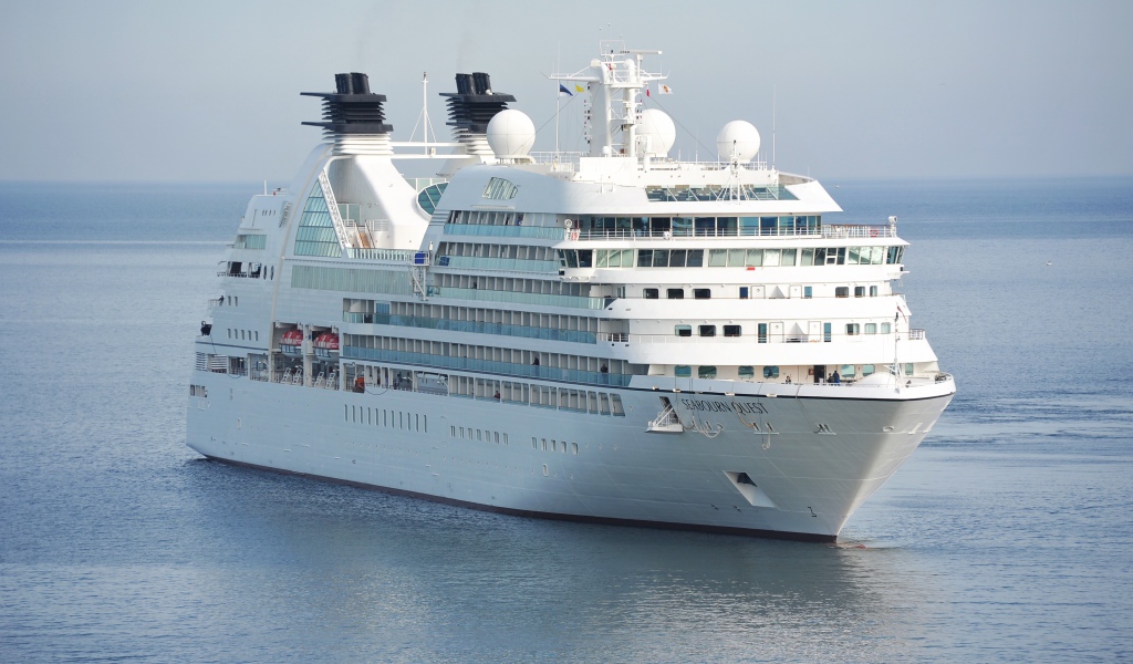 Large white cruise ship SEABOURN QUEST at sea