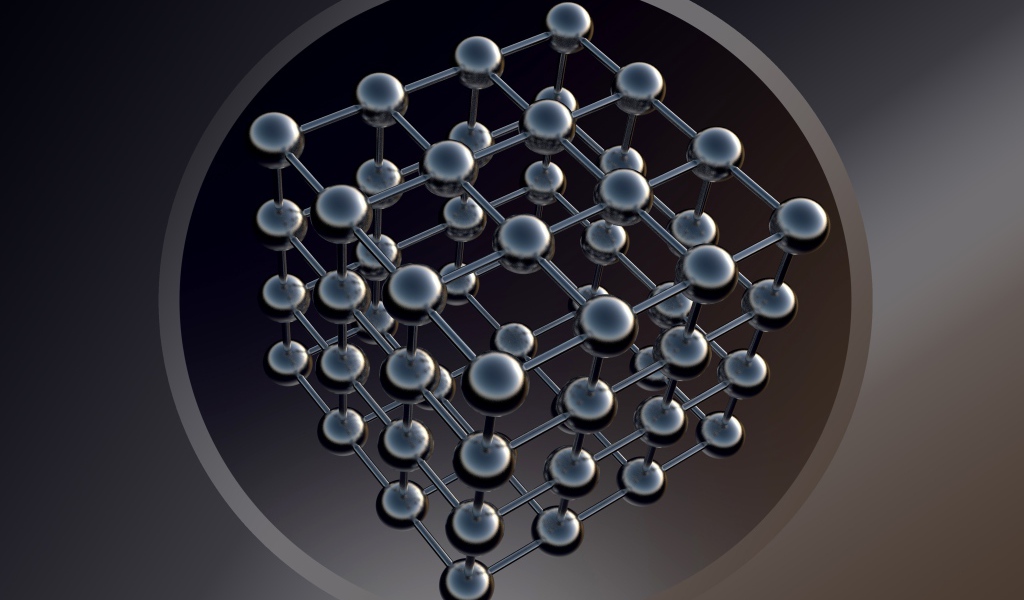 Шестигранник с черными шарами на сером фоне
