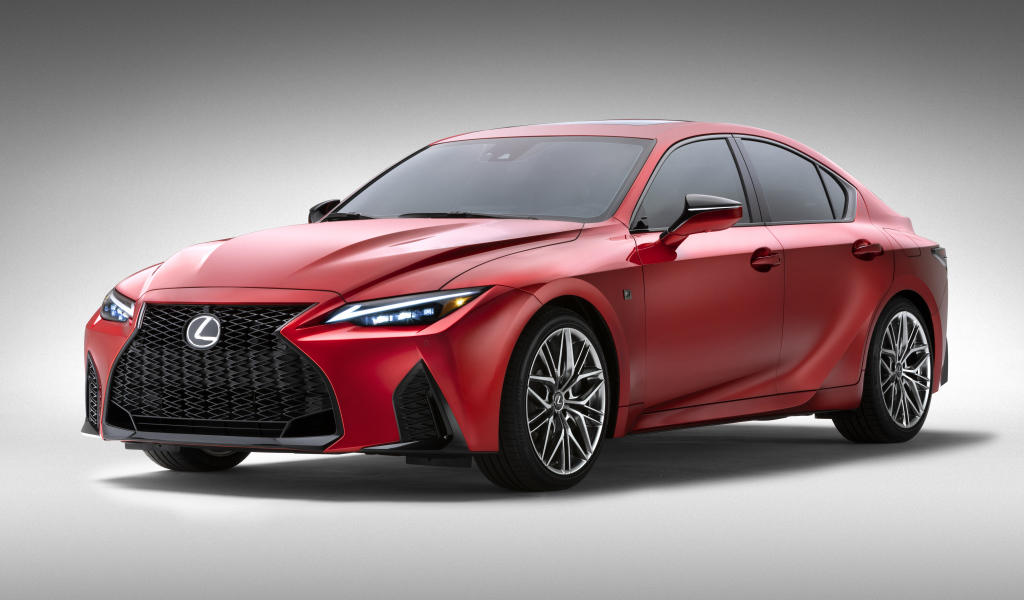 Красный Lexus IS 500 F SPORT Performance, 2022 года на сером фоне