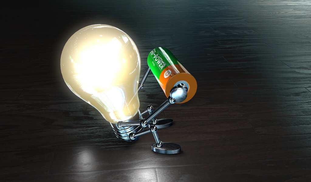 Лампочка с батарейкой в руках на полу