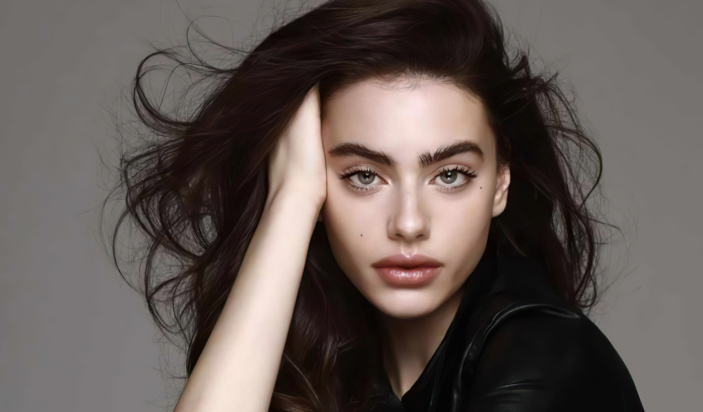 Israeli model Yael Shelbia on a gray background