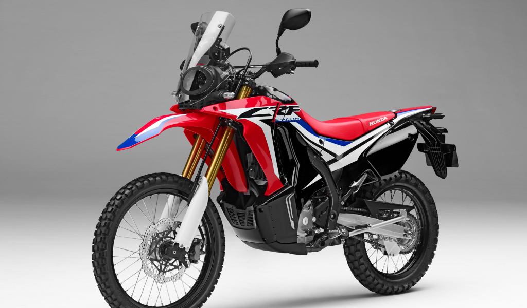 Sports motorcycle Honda CRF250L Rally on a gray background