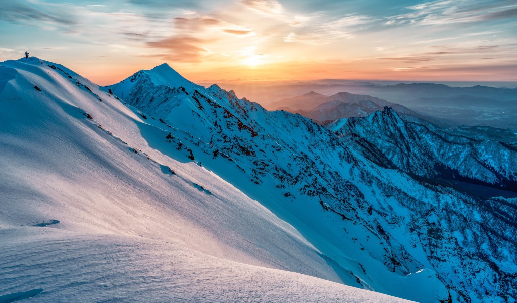 Beautiful view of the snow-capped mountains at sunrise