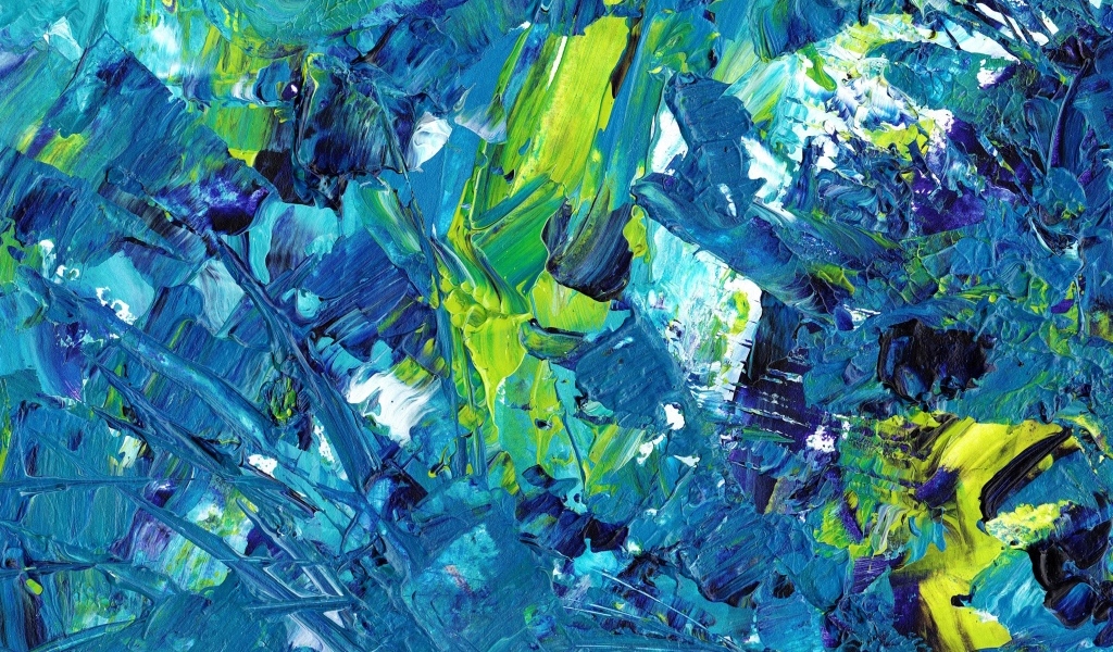 Синие и желтые краски смешанные на палитре