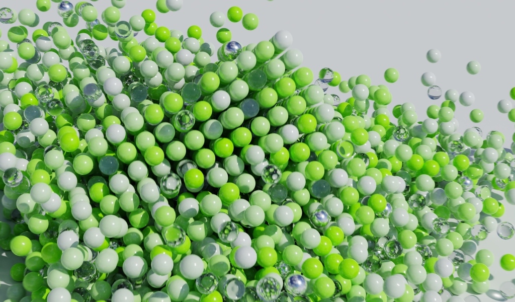 Много пластиковых и стеклянных зеленых шариков