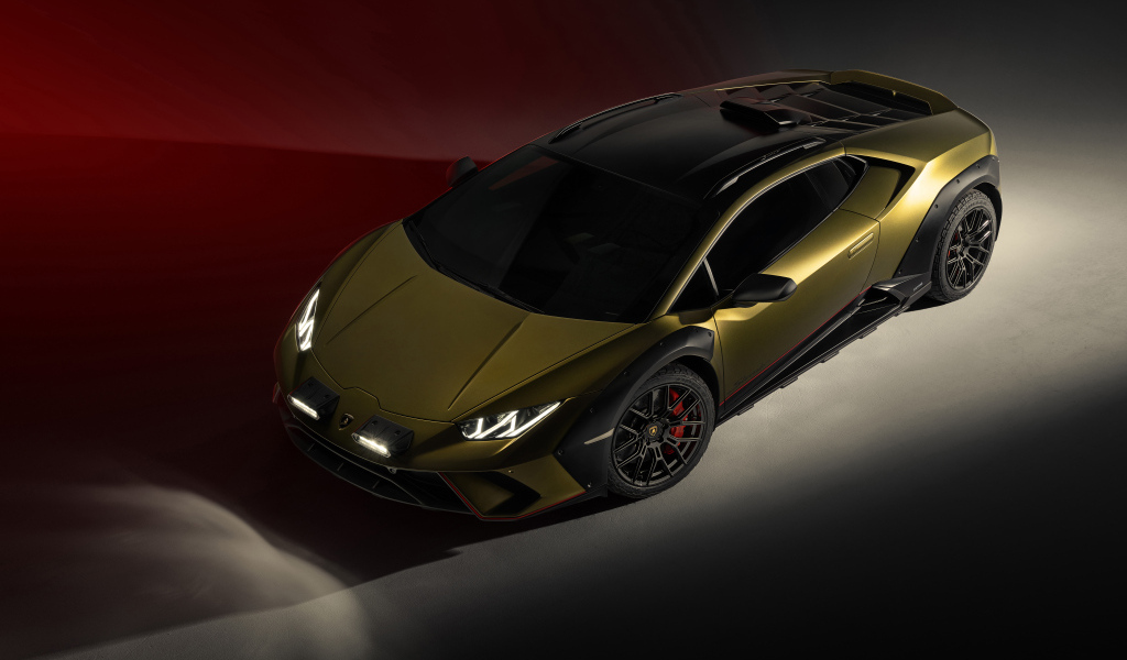 Автомобиль Lamborghini Huracan Sterrato 2023 года на сером фоне