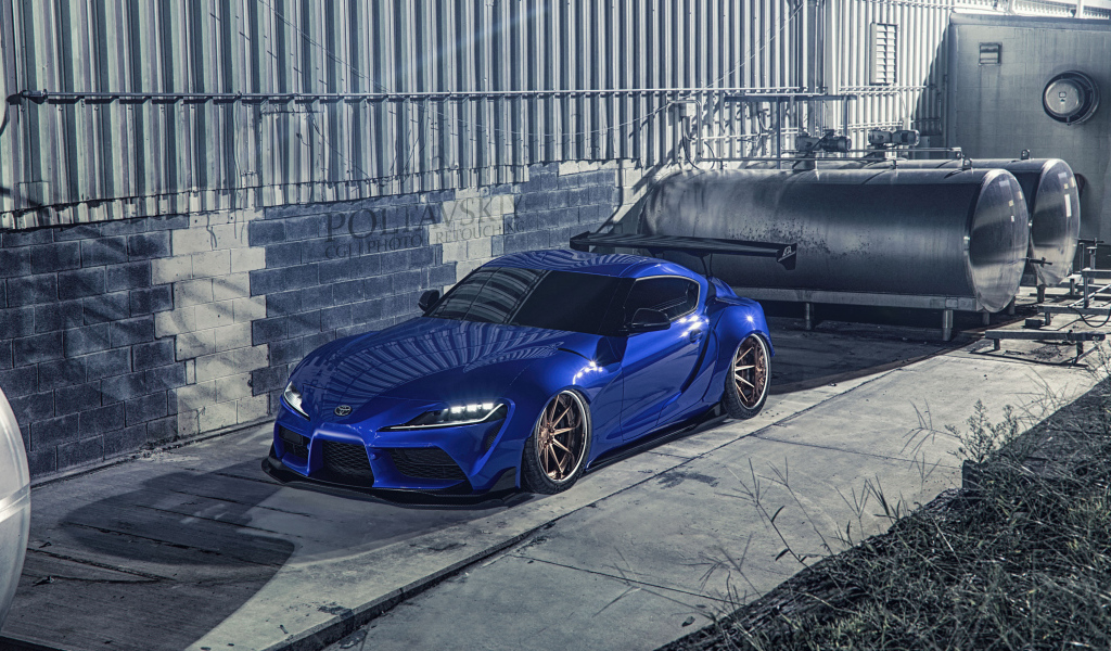 Синий спорткар Toyota Supra Luxury у здания