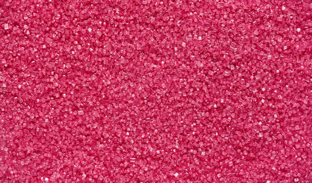 Мелкий розовый сахар для фона