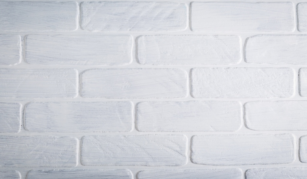 Белая кирпичная стена крупным планом
