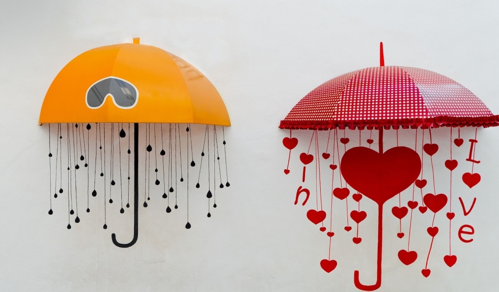 Два нарисованных зонта на серой поверхности