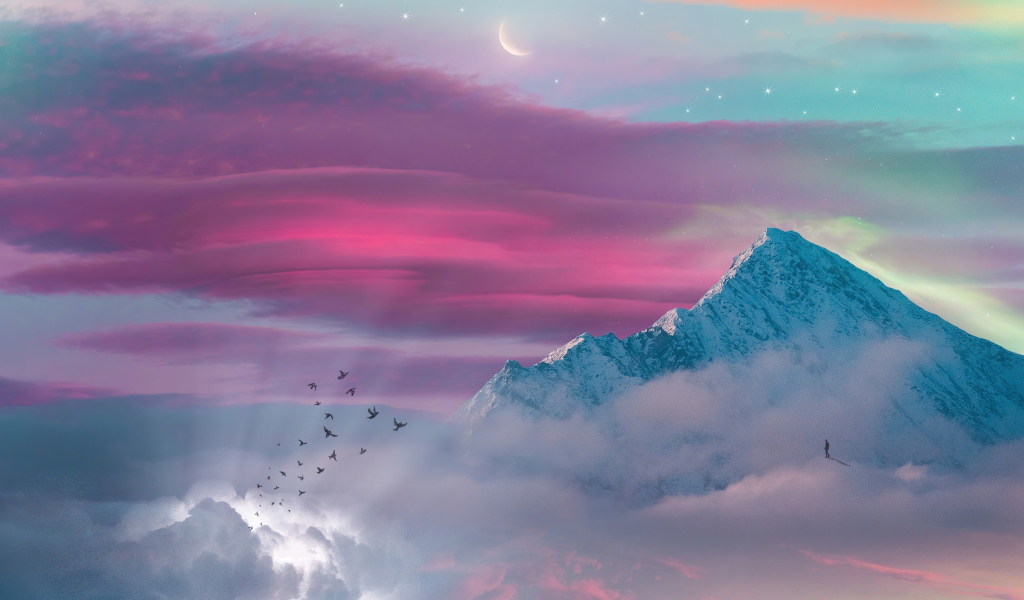 Птицы летят к заснеженной вершине горы