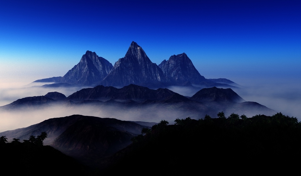 Три горные вершине в тумане