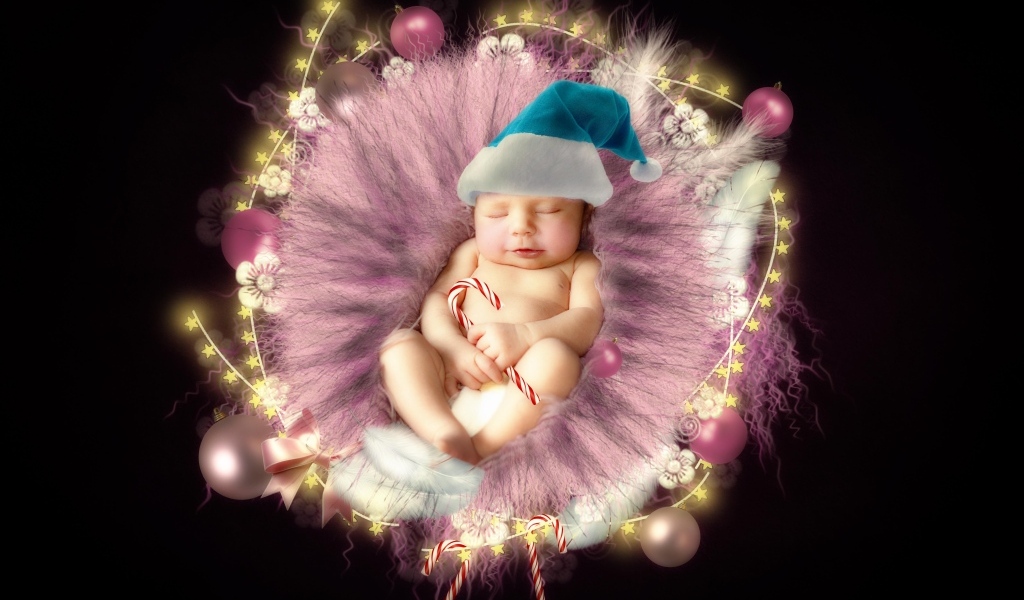 Красивый новорожденный ребенок в колыбели на черном фоне